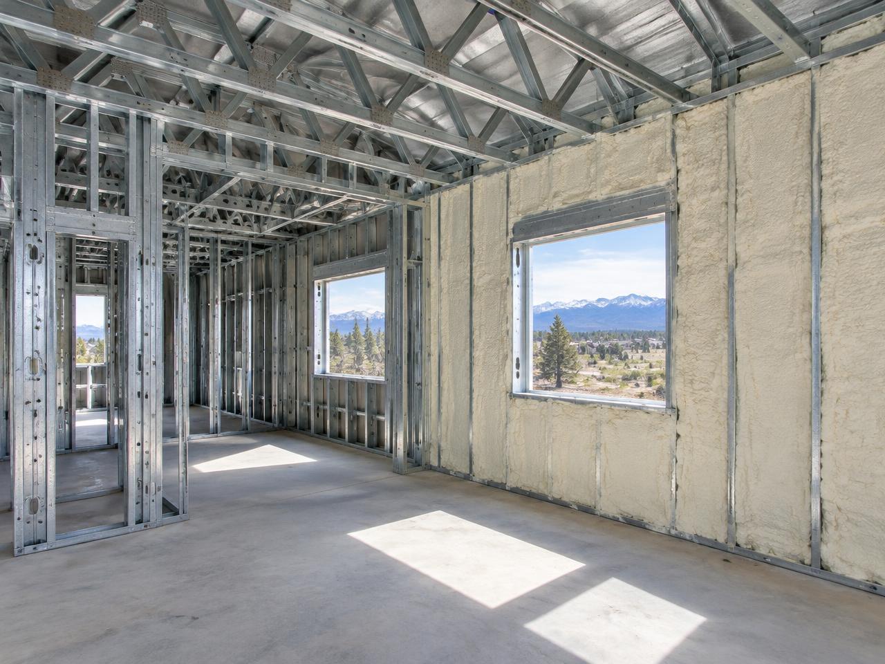 Light-gauge steel frame interior with spray foam insulation
